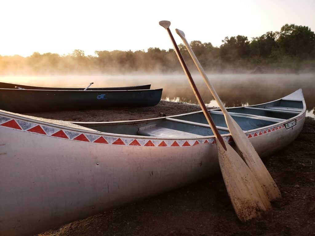 A canoe resting on a river sandbar