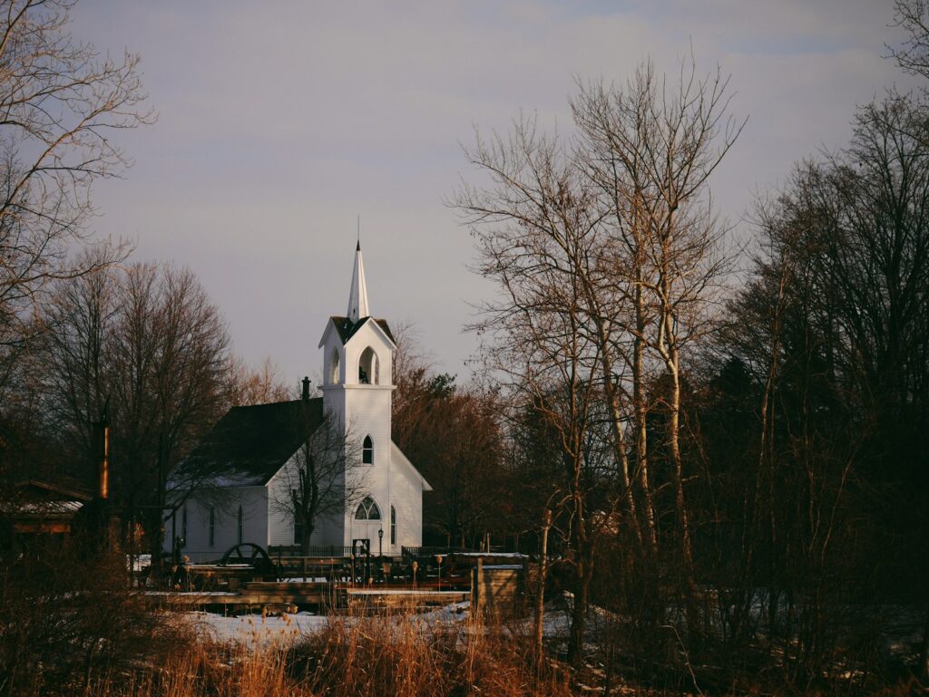 A small white country church near trees
